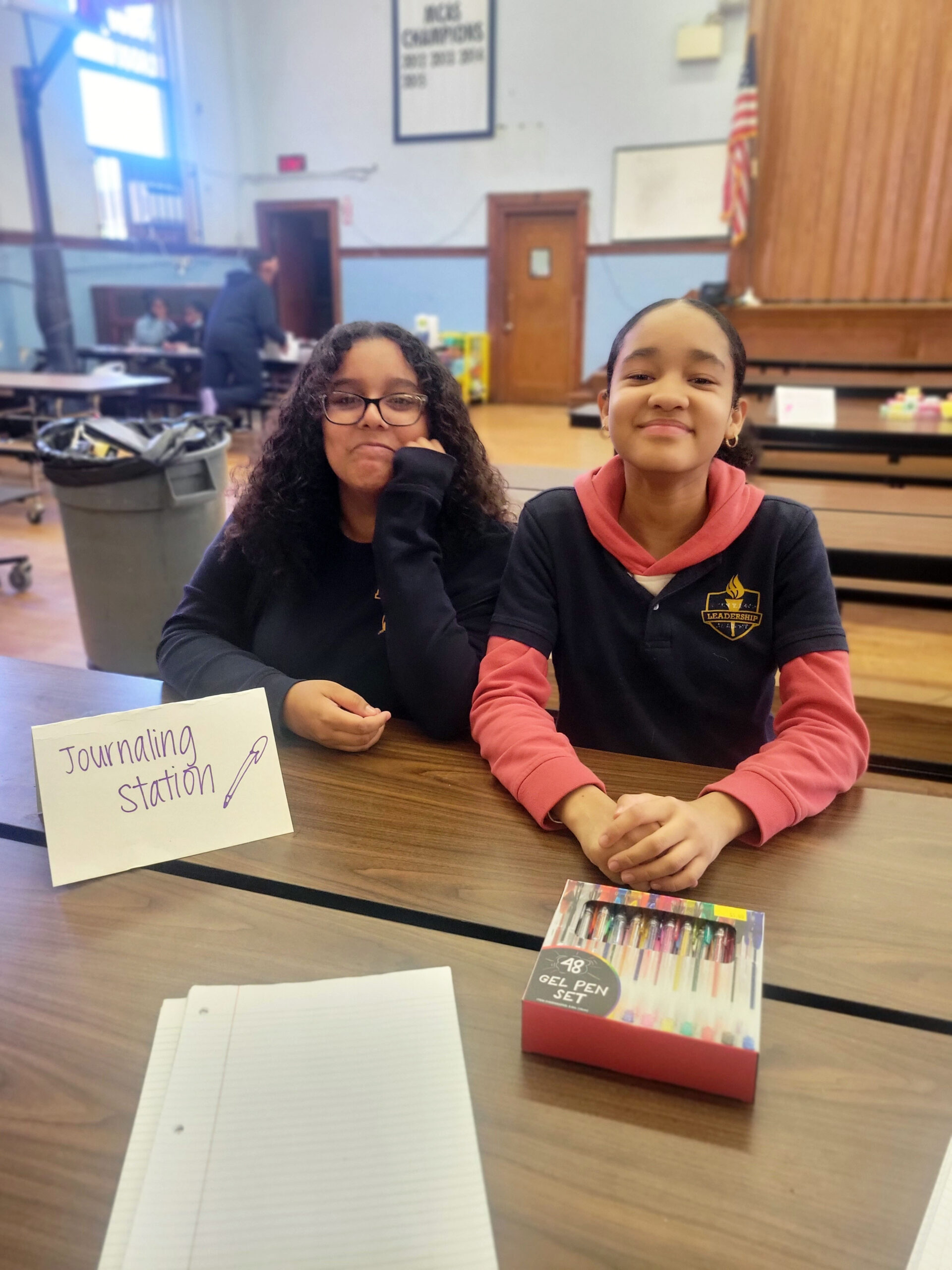 Two young girls smiling